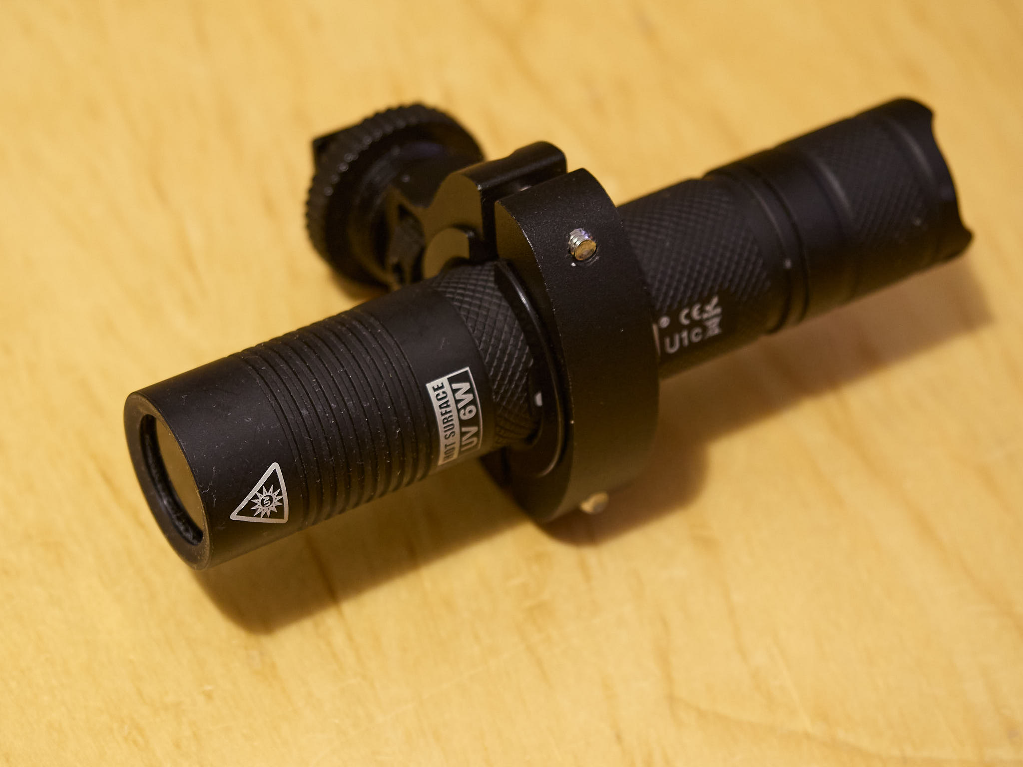 C: Jaxman Uc1 flashlight with a 6 W UV-A 365nm LED attached to anad-hocholder.